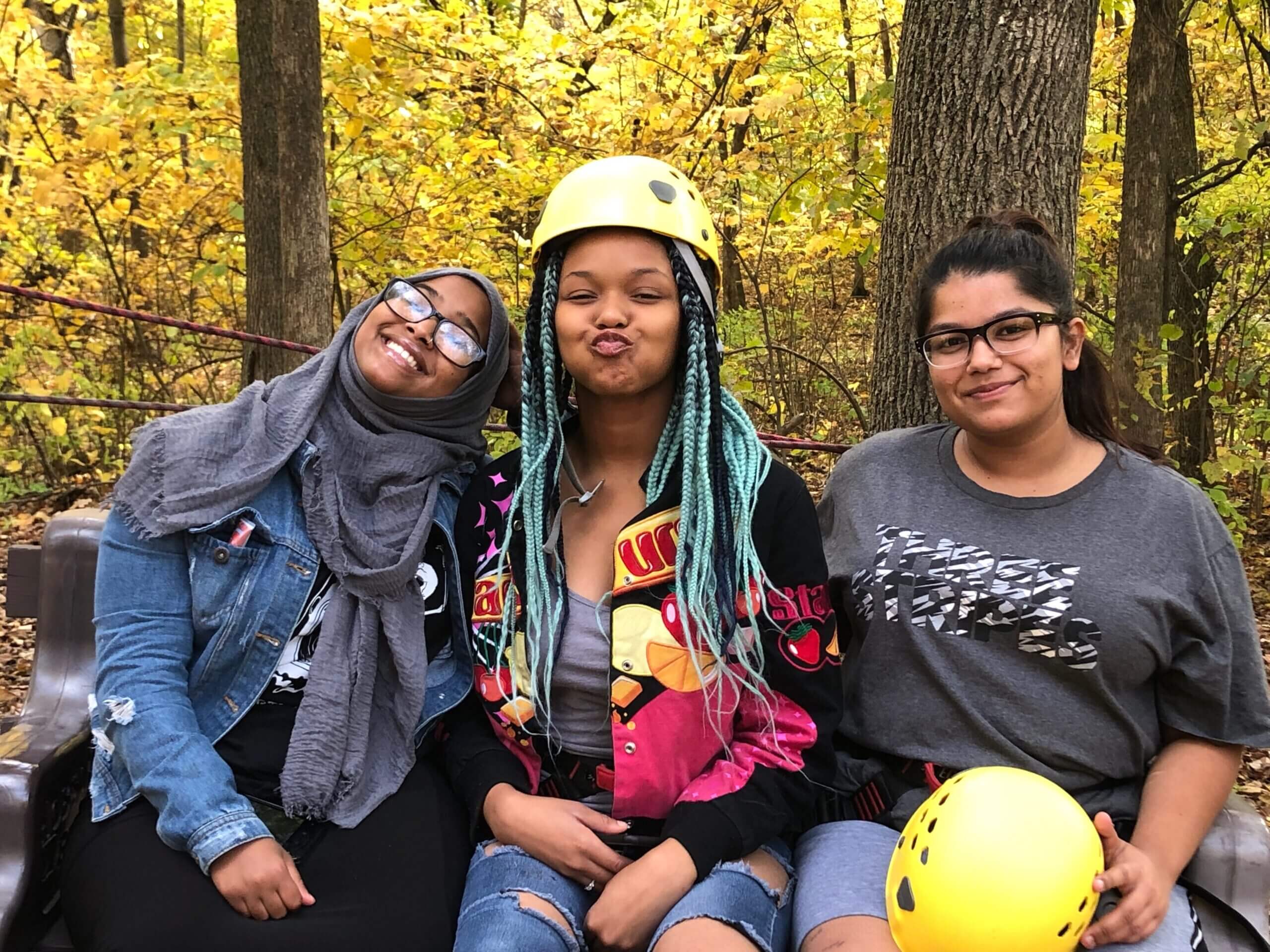 students smiling at rope course
