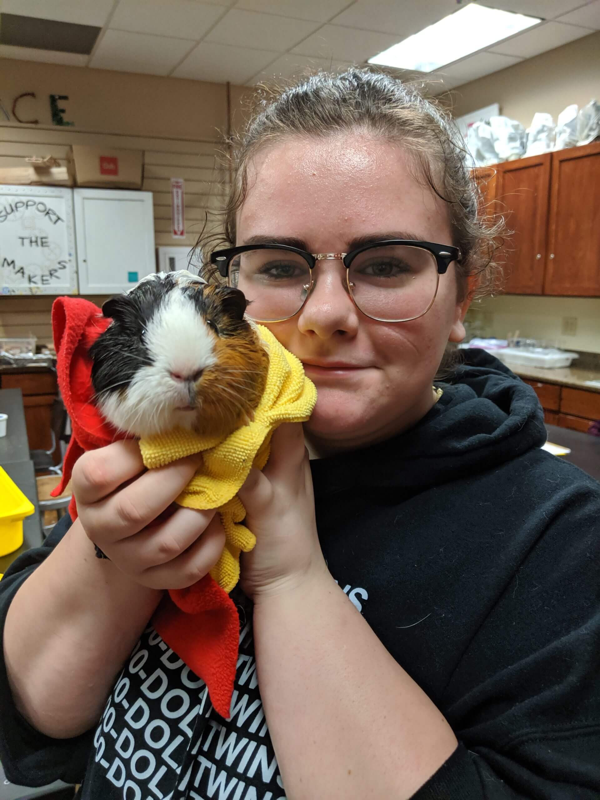 student with guinea pig